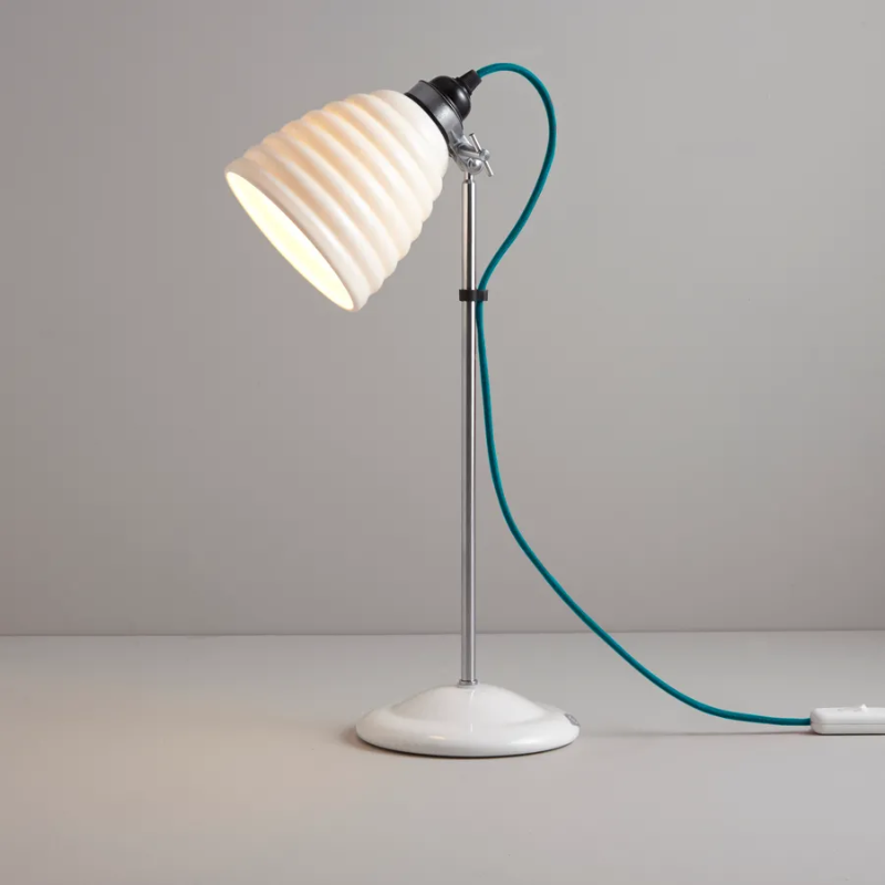 The Hector Bibendum, designed by Sir Terence Conran to celebrate Original BTC's 21st birthday and the Michelin building's centenary, is a fresh take on the classic Hector light. With a white, layered shade and colorful cotton-braided flex, this is a stylish light for the home.