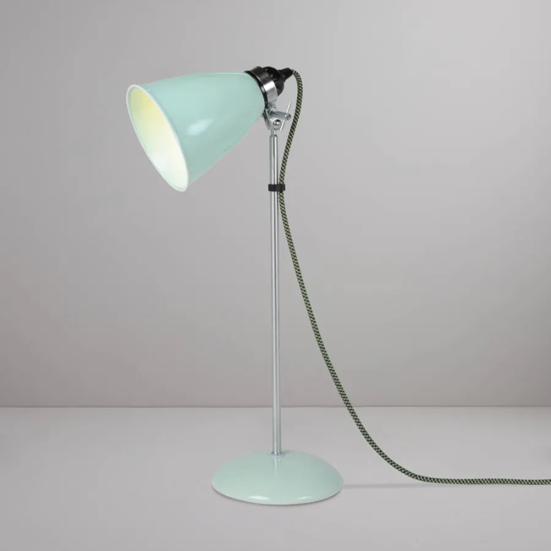 A British design classic in translucent Bone China. With its moveable shade and smart cotton braided cable, the Hector Table Light perfectly combines style and function. Available in three colors (natural white, light blue or light green) with varying sized shades.