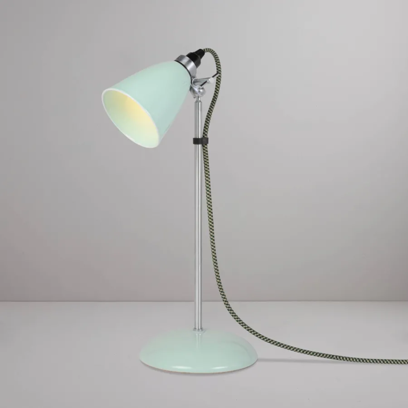 A British design classic in translucent Bone China. With its moveable shade and smart cotton braided cable, the Hector Table Light perfectly combines style and function. Available in three colors (natural white, light blue or light green) with varying sized shades.