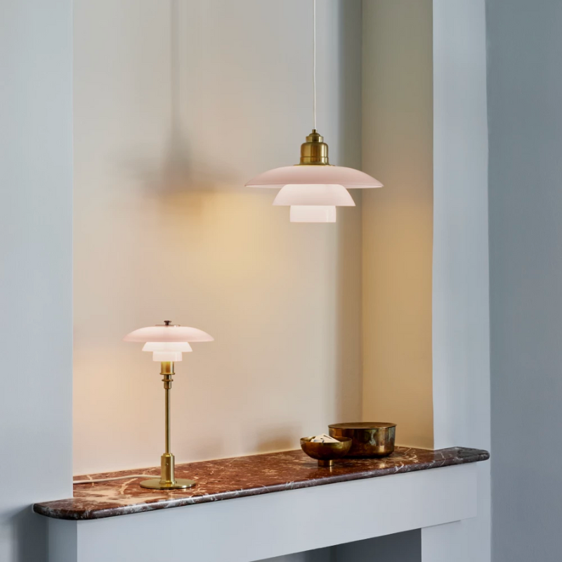 PH 2/1 Pale Rose Brass Table lamp features intricate design details, which come together to create an elegant expression and a soft, warm light in your home. The glossy pale rose shades are poetic and speak to modern interior trends, while the inside of the shades is sandblasted white, to create the glare-free light characteristic of Louis Poulsen’s lamps. 