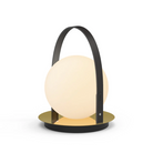 The Bola Lantern from Pablo Designs with the black handle and brass base.