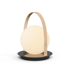 The Bola Lantern from Pablo Designs with the tan handle and black base.