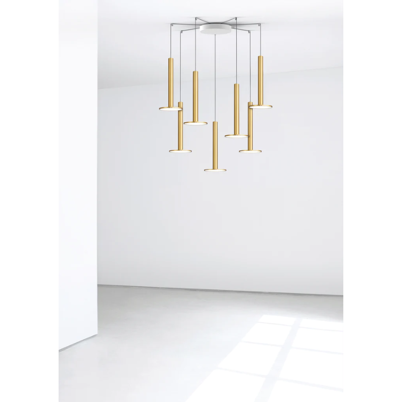 The Cielo XL Multi-Light Canopy from Pablo Designs being used in a hallway display with brass Cielo XL pendants.