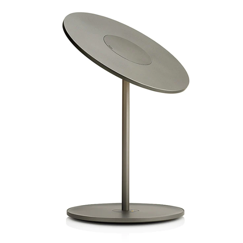 The Circa Table light from Pablo Designs in graphite. The reverse shot allows you to see the other side of the light, and the top of the lamp.