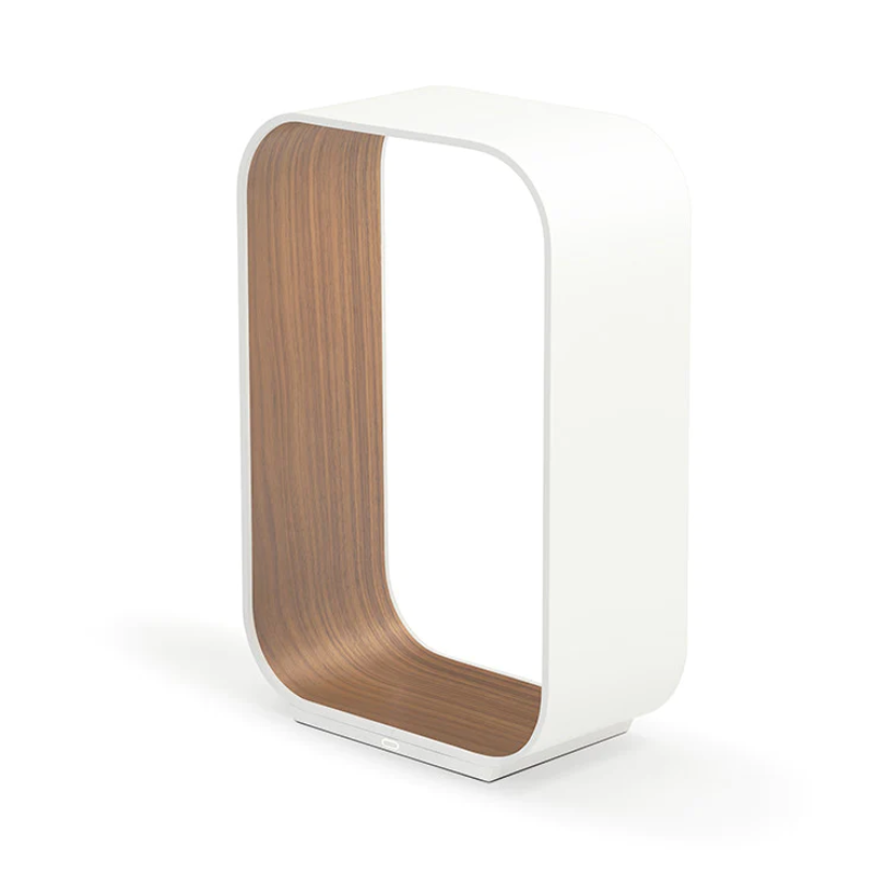 The small version of the Contour Table light from Pablo Designs in white and walnut.