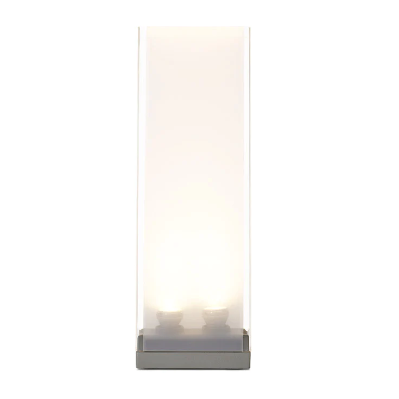 The timeless Cortina lamp is architectural simplicity. Its stoic clear acrylic shade features a sensual translucent mesh fabric diffuser to shield the lamp's dimmable light source. Cortina allows you to set any mood, depending on the moment.