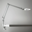 The medium Link Clamp from Pablo Designs in silver mounted to a table.