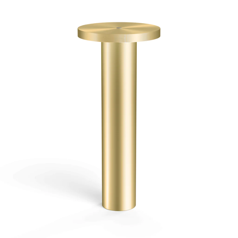The Luci Table from Pablo Designs in brass.