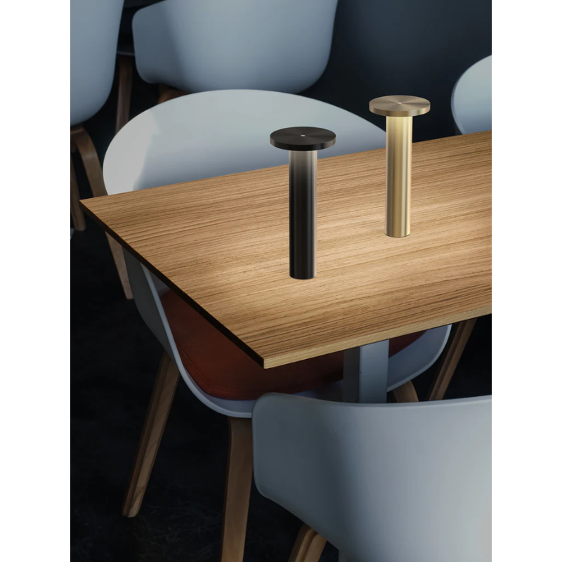 The Luci Table from Pablo Designs within a restaurant. 