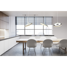 A trio of Nivél Pendants from Pablo Designs in an office style break room.