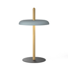 The Nivél Table from Pablo Designs with an oak post and slate blue shade.