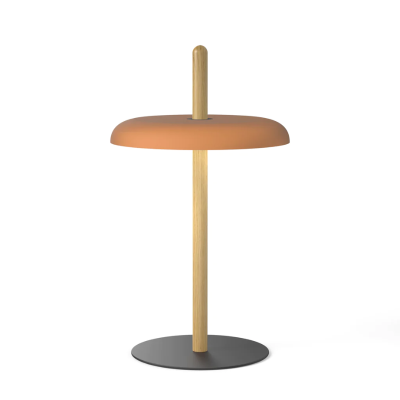 The Nivél Table from Pablo Designs with an oak post and terracotta shade.