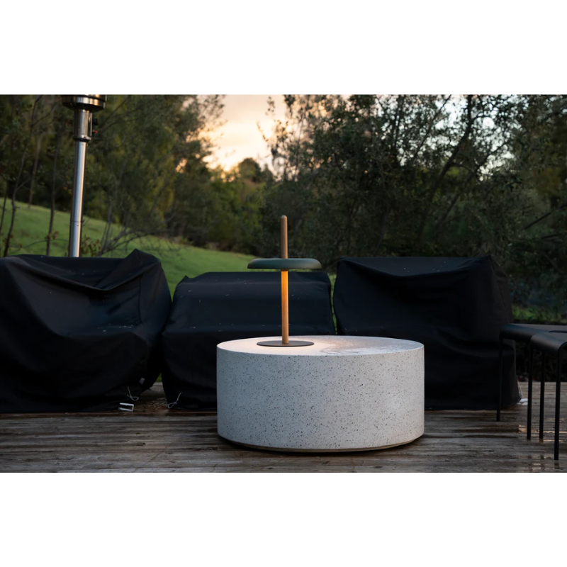 The Nivél Table from Pablo Designs outdoors, showing the portable nature of the light.