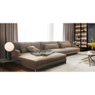 The Pilar from Pablo Designs in a living room next to a sectional sofa.
