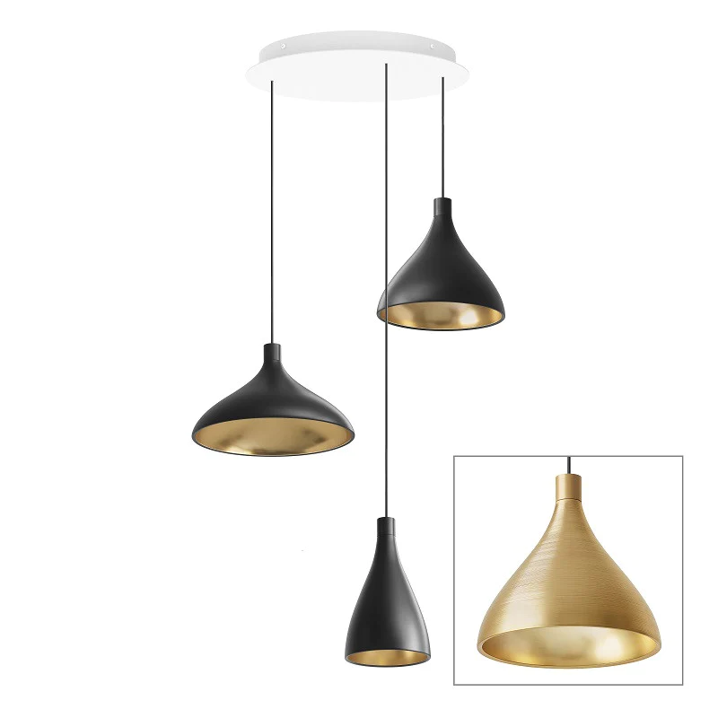 The Swell Chandelier from Pablo Designs with 3 pendants in brass.