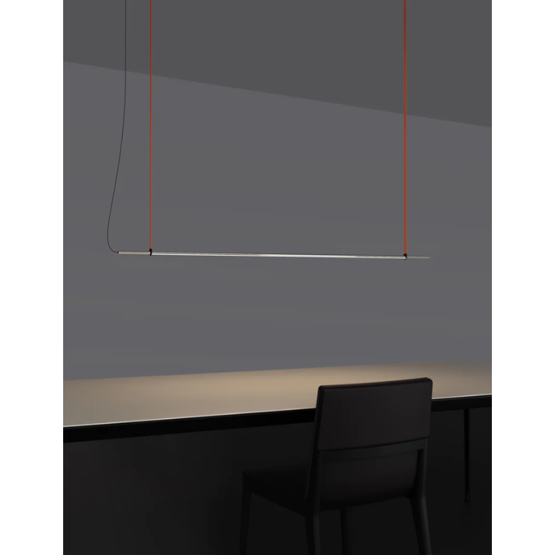 The T.O Pendant from Pablo Designs over the desk in an office space.