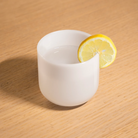 The Totem Mini Kit from Pablo Designs being used as a cup with a lemon wedge on the side.