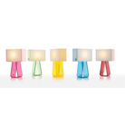 Five of the color options of the 14 inch Tube Top Table from Pablo Designs. Starting with hot pink on the left, green, yellow, cobalt and then ruby red.
