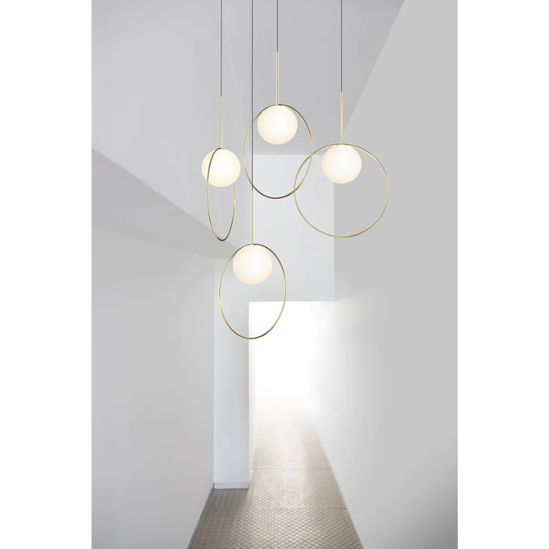 The Bola Halo from Pablo Designs in a multiple pendant display.