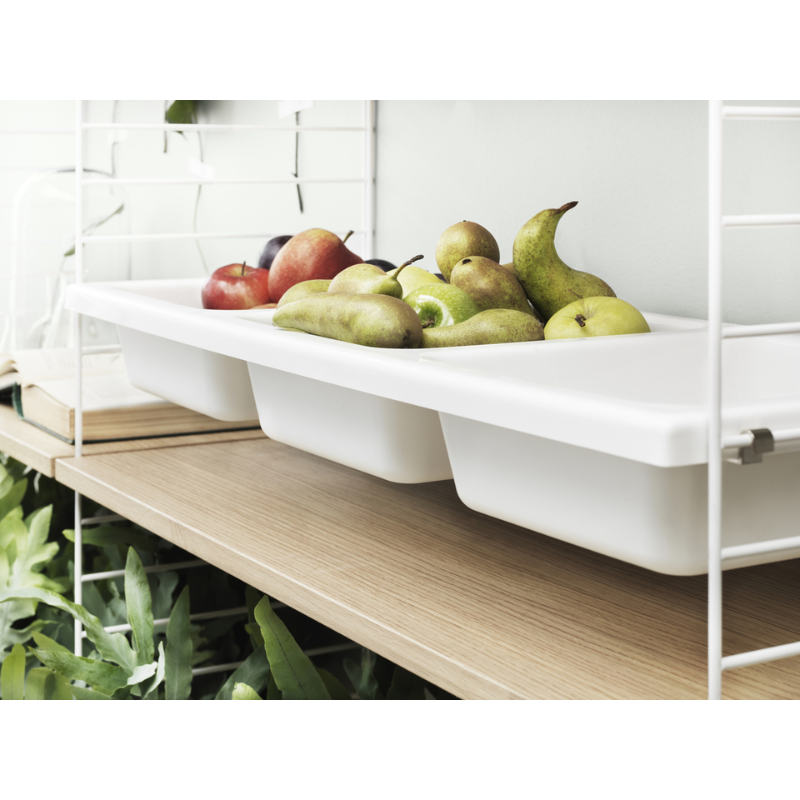 The Bowl Shelf from String Furniture in a kitchen and dining space lifestyle photograph.