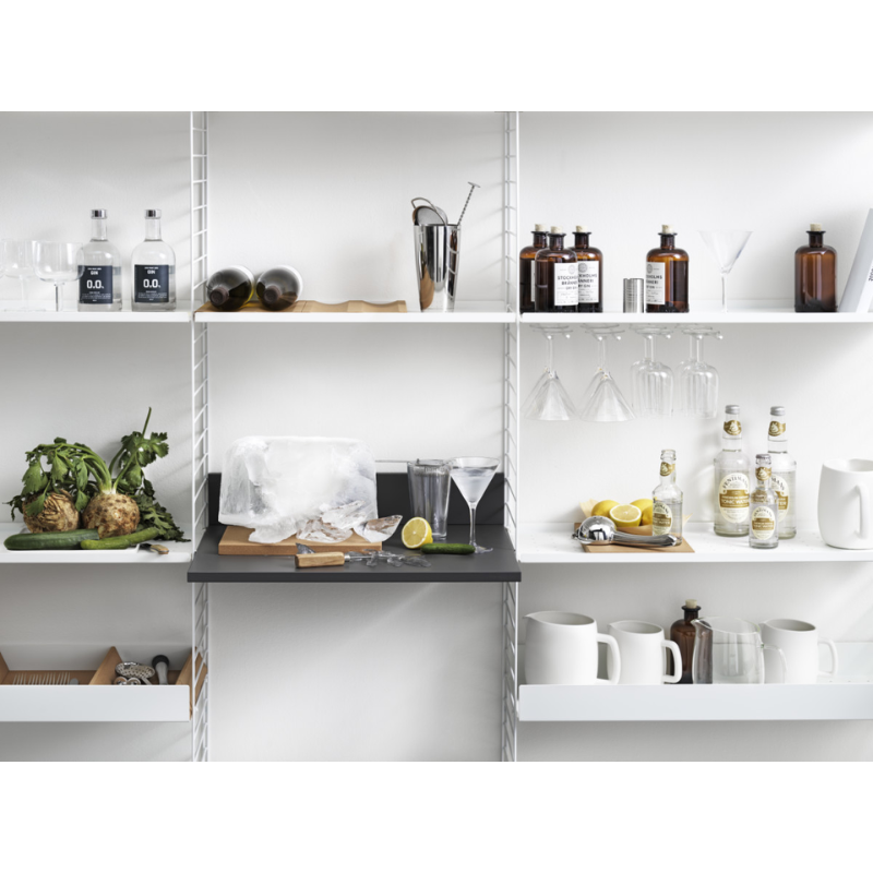 The Media Shelf from String Furniture in a kitchen.