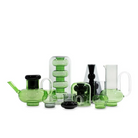 The Bump Jug in green by Tom Dixon alongside the rest of the Bump collection. The Bump Jug is on the far right, behind a Bump Tall Glass.