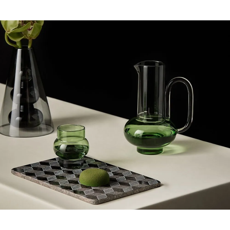 The Bump Short Glasses Green (Set of 2) from Tom Dixon in a bar set up.