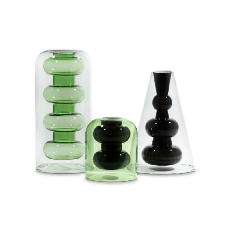 The Bump Vase Short Black by Tom Dixon with the other two vases in the Bump collection.