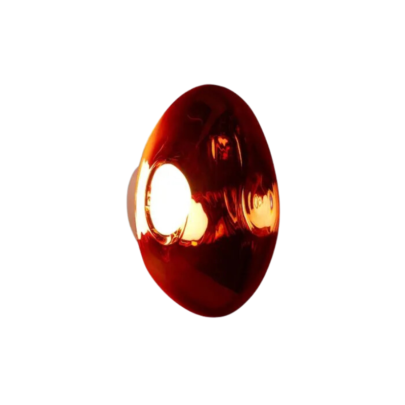 Tom Dixon's Melt LED Surface Wall Sconce is a beautifully distorted pendant in collection of modern finishes with matching ceiling rose. Featuring an integrated LED module, this ceiling light creates a mesmerizing melting hot-blown glass effect when turned on, and a mirror-finish effect when off. This piece is made in Germany using a high tech manufacturing techniques to achieve the perfect melted orb for your design.