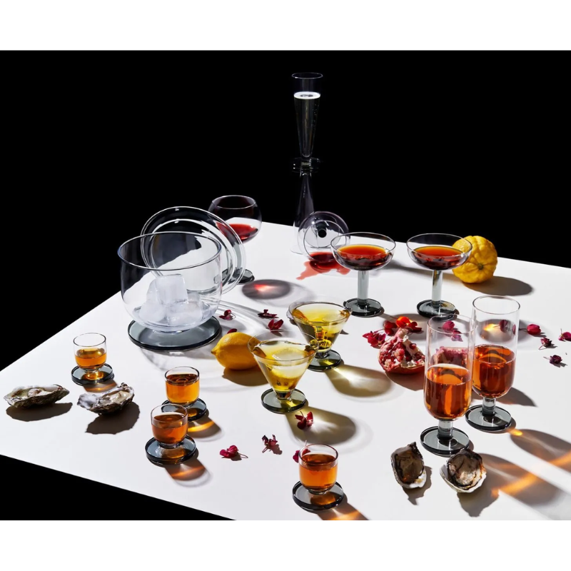All of the products in the Puck collection from Tom Dixon, with the Puck Shot Glasses towards the bottom left.