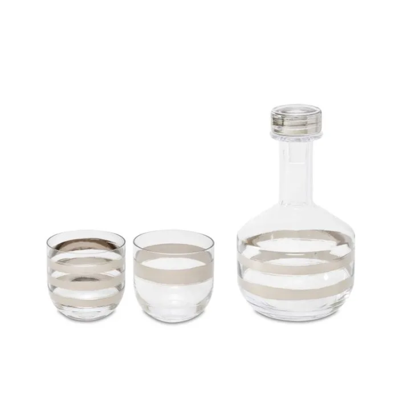 The Twenty Tank Whiskey Set from Tom Dixon featuring two glasses and a decanter.