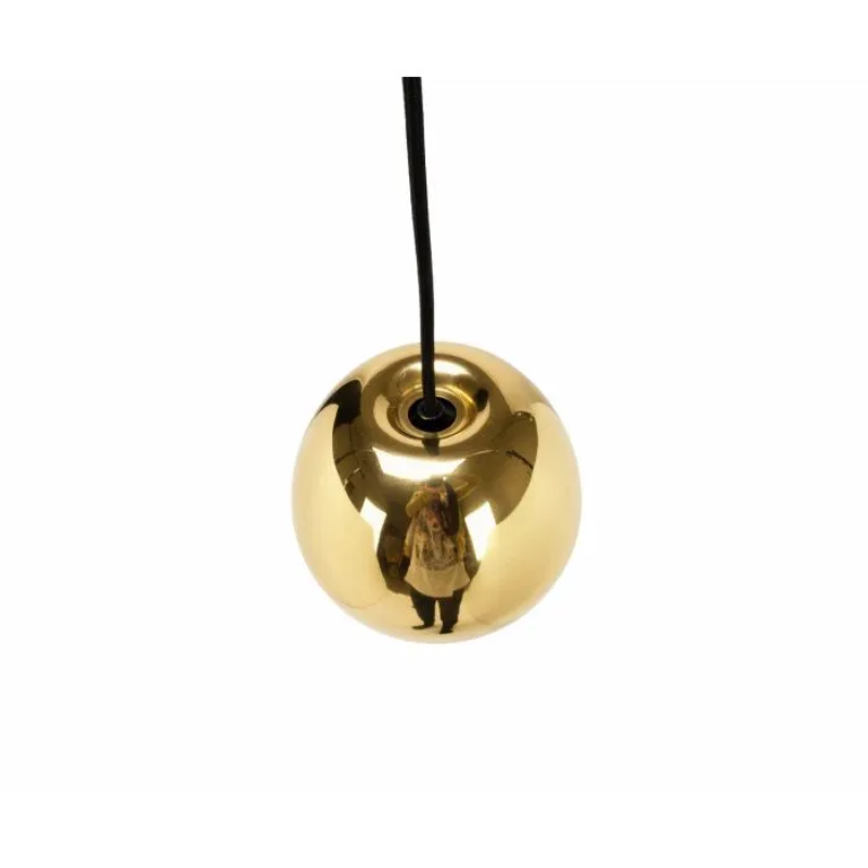 The process of creating Tom Dixon's Void is complex. Cut from a sheet of pure metal, each light is then pressed and spun, and brazed at the end to form a double-walled shade. The high-shine reflectivity achieved with lathing, polishing and caring for the base metals is a bold finish that carries across the Void collection.