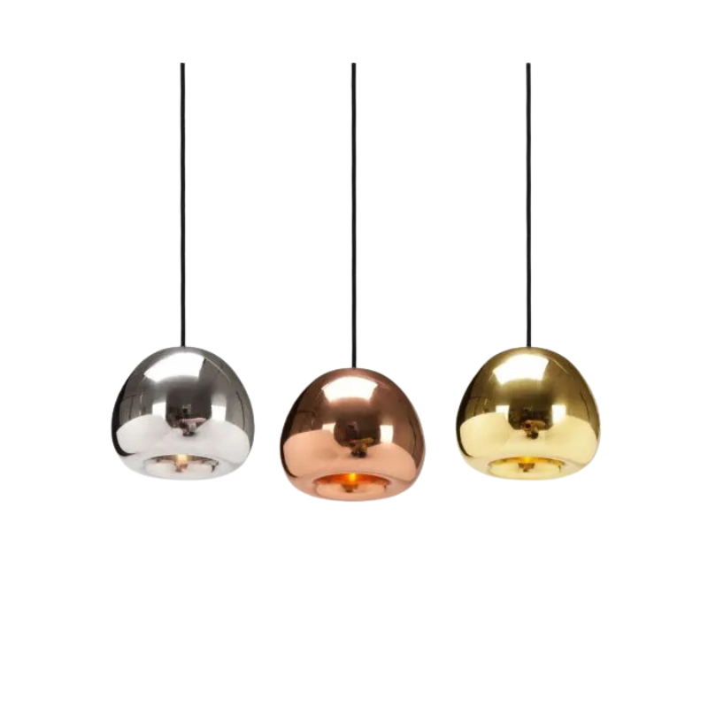 The process of creating Tom Dixon's Void is complex. Cut from a sheet of pure metal, each light is then pressed and spun, and brazed at the end to form a double-walled shade. The high-shine reflectivity achieved with lathing, polishing and caring for the base metals is a bold finish that carries across the Void collection.