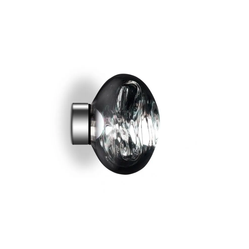 Tom Dixon's Melt is a beautifully distorted pendant in a modern Copper, Gold, Smoke and Chrome finishes and matching ceiling canopies. Featuring our integrated LED module, this ceiling light creates a mesmerizing melting hot-blown glass effect when on and a mirror-finish effect when off. Made in Germany using a high tech manufacturing technique to achieve the perfect melted orb.