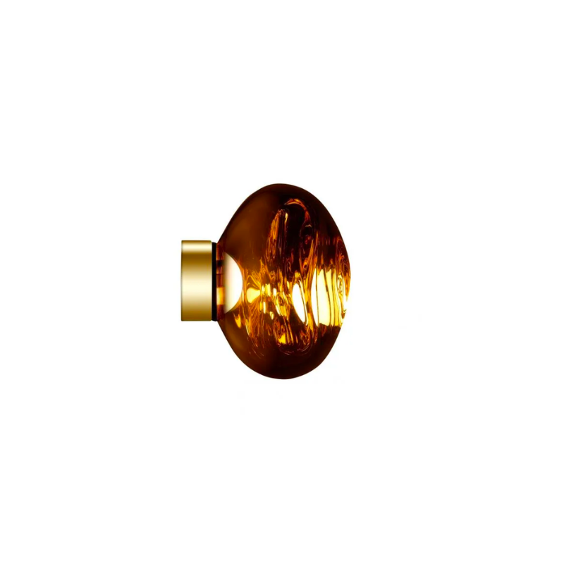 Tom Dixon's Melt is a beautifully distorted pendant in a modern Copper, Gold, Smoke and Chrome finishes and matching ceiling canopies. Featuring our integrated LED module, this ceiling light creates a mesmerizing melting hot-blown glass effect when on and a mirror-finish effect when off. Made in Germany using a high tech manufacturing technique to achieve the perfect melted orb.