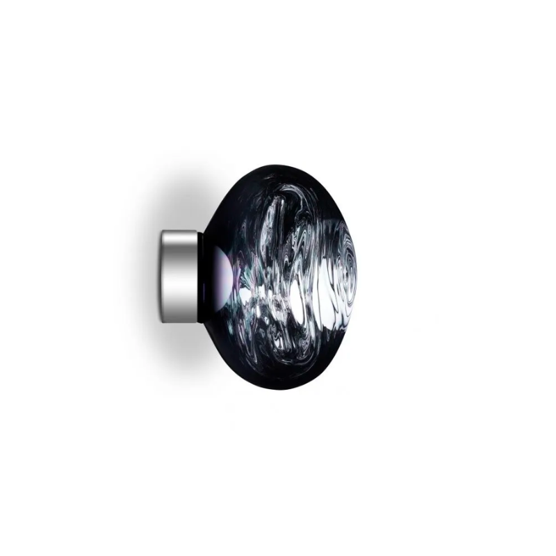 Tom Dixon's Melt is a beautifully distorted pendant in a modern Copper, Gold, Smoke and Chrome finishes and matching ceiling canopies. Featuring our integrated LED module, this ceiling light creates a mesmerizing melting hot-blown glass effect when on and a mirror-finish effect when off. Made in Germany using a high tech manufacturing technique to achieve the perfect melted orb.