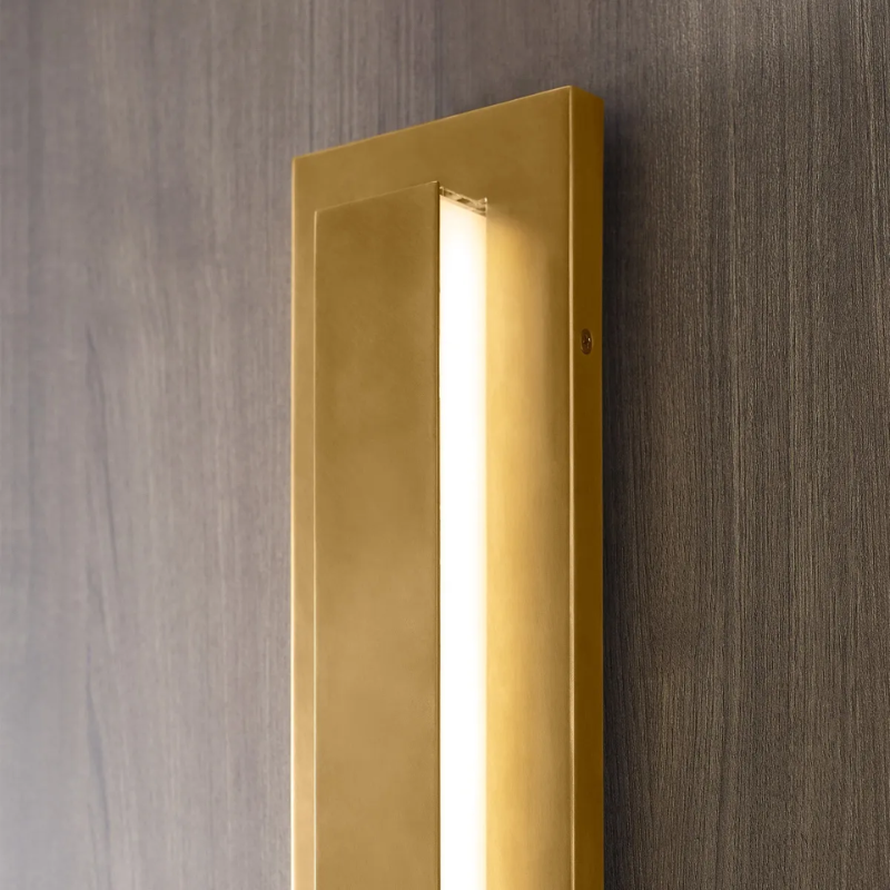 The Aspen Outdoor Wall Sconce from Visual Comfort and Co in a lounge space.