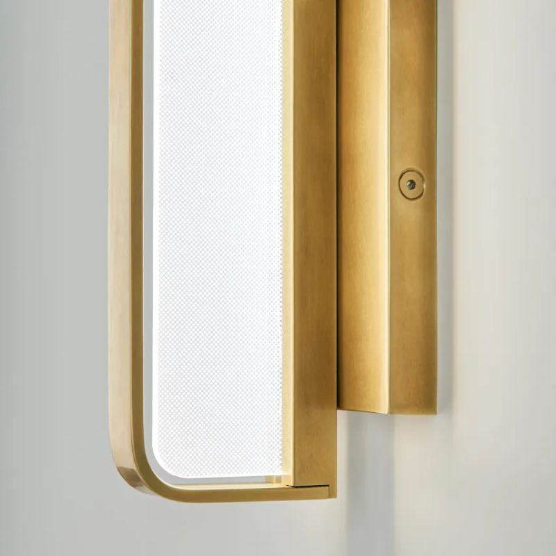 The Banda Vertical Wall Sconce from Visual Comfort & Co. in a close up lifestyle photograph.
