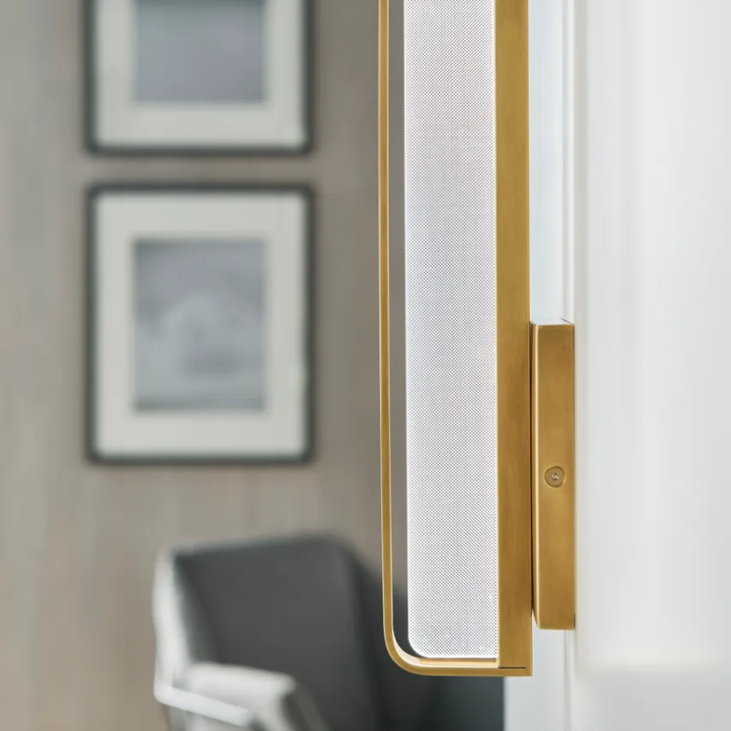 The Banda Vertical Wall Sconce from Visual Comfort & Co. in a commercial space.