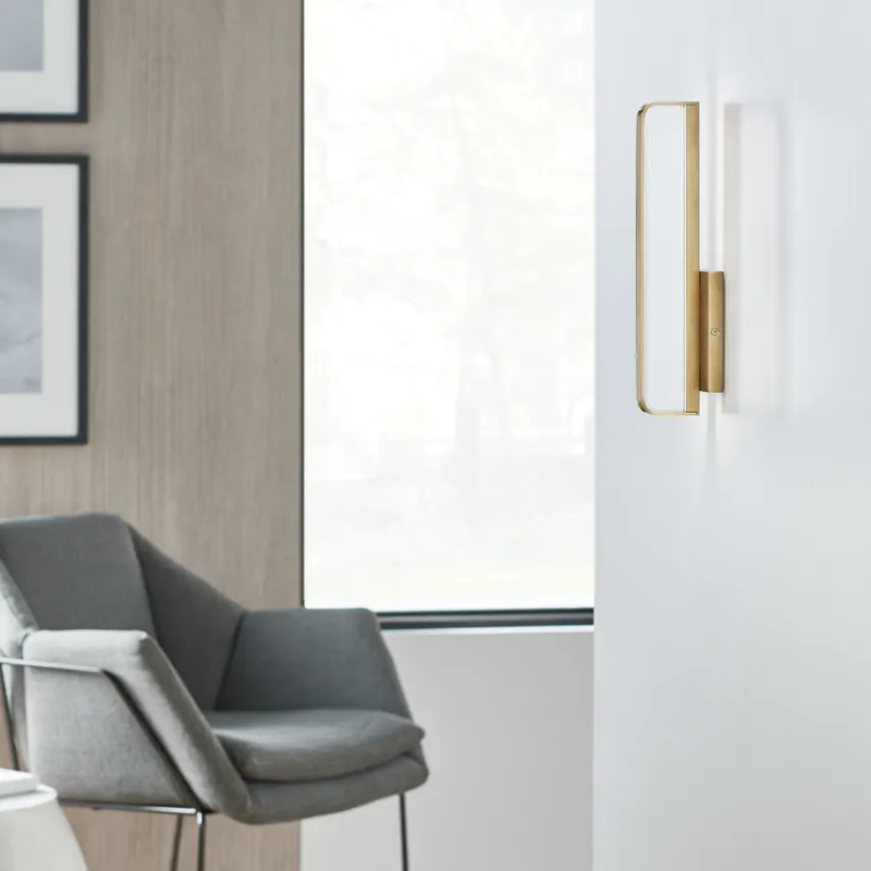 The Banda Vertical Wall Sconce from Visual Comfort & Co. in an office.