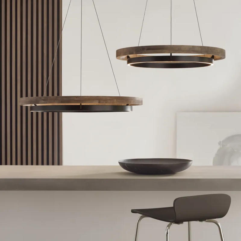 The Grace Chandelier by Sean Lavin is designed with two rings that illuminate this contemporary chandelier. A large outer ring provides organic texture while complemented by a decorative inner ring, housing gently diffused upward and downward LEDs.