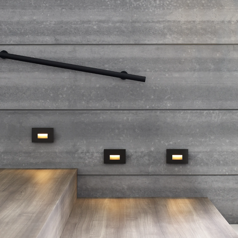The Ikon Outdoor Step Light from Visual Comfort and Co in a living area.
