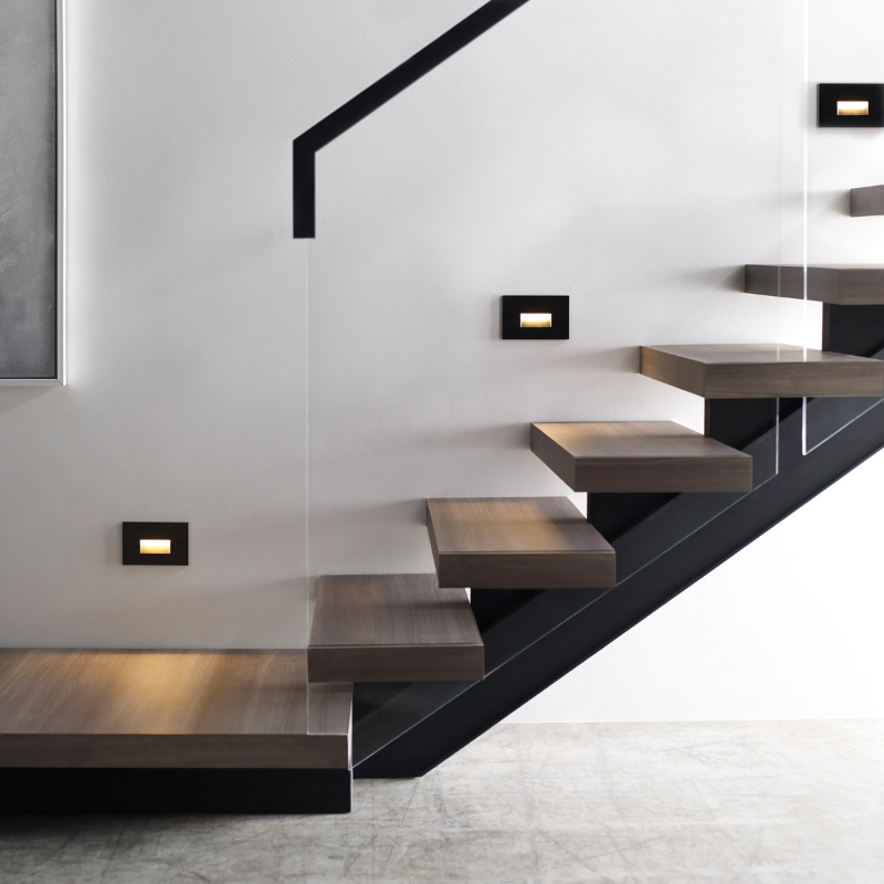 The Ikon Outdoor Step Light from Visual Comfort and Co lighting up a staircase.