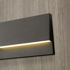 The Krysen Outdoor Step Light from Visual Comfort and Co in a close up lifestyle photograph of the LED.