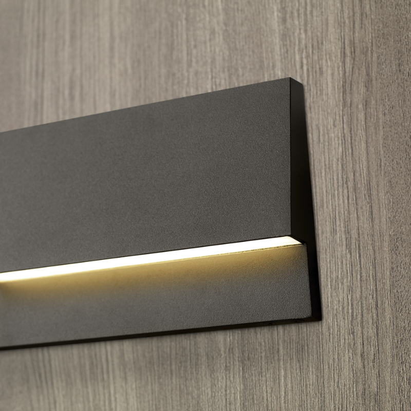 The Krysen Outdoor Step Light from Visual Comfort and Co in a close up lifestyle photograph of the LED.