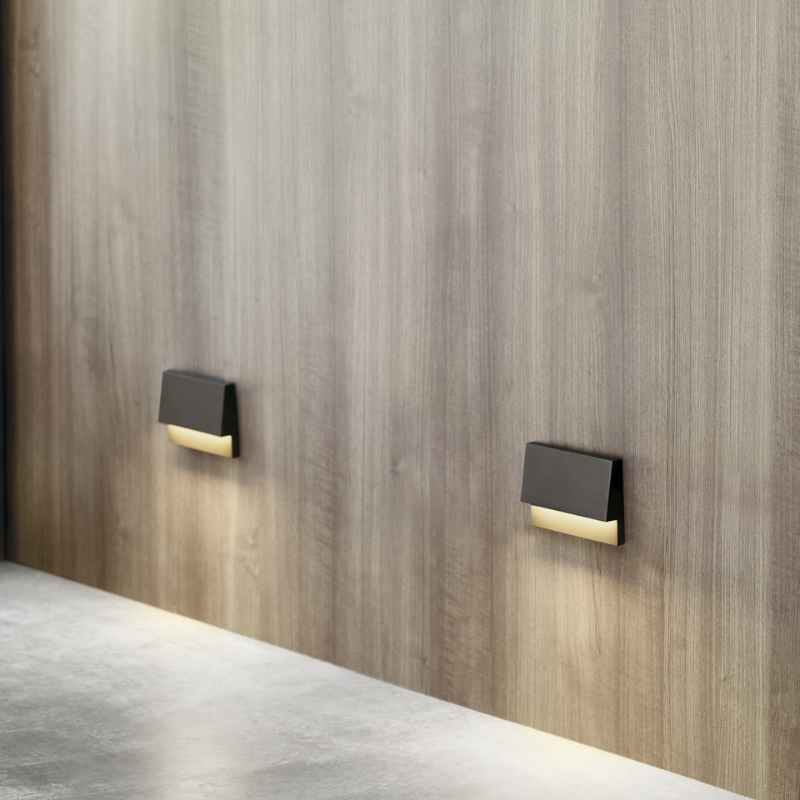 The Krysen Outdoor Step Light from Visual Comfort and Co lighting up a pathway.