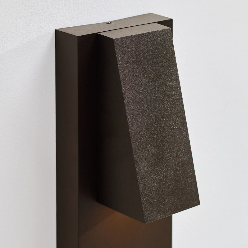 The Peak Outdoor Wall Sconce from Visual Comfort and Co in an outdoor living area.