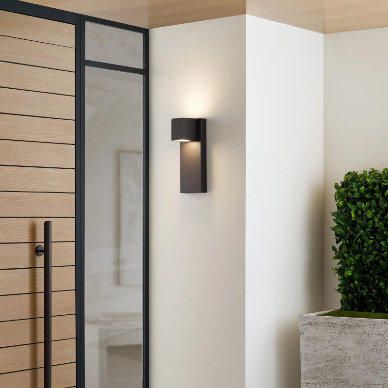The Quadrate Outdoor Wall Sconce from Visual Comfort and Co beside an entryway.