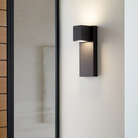 The Quadrate Outdoor Wall Sconce from Visual Comfort and Co in a living area lifestyle photograph.