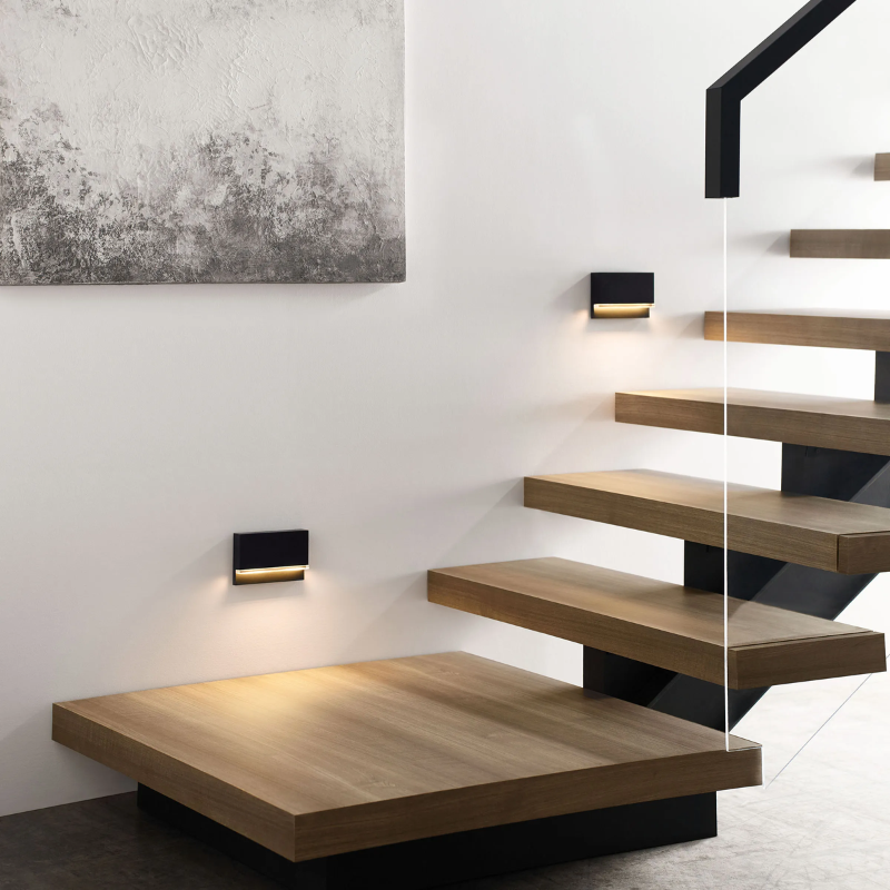 The Wend Outdoor Step Light from Visual Comfort and Co lighting up stairs.